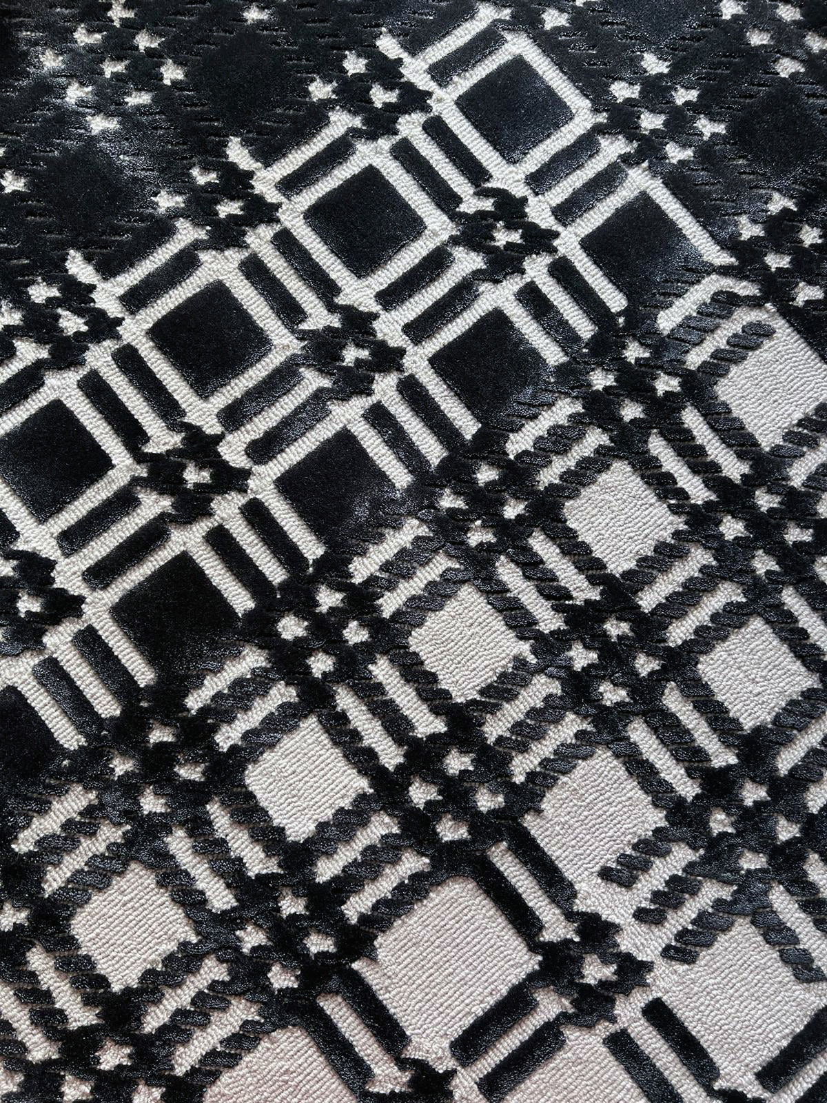 Plaid Chanel rug by Volver Studios black white